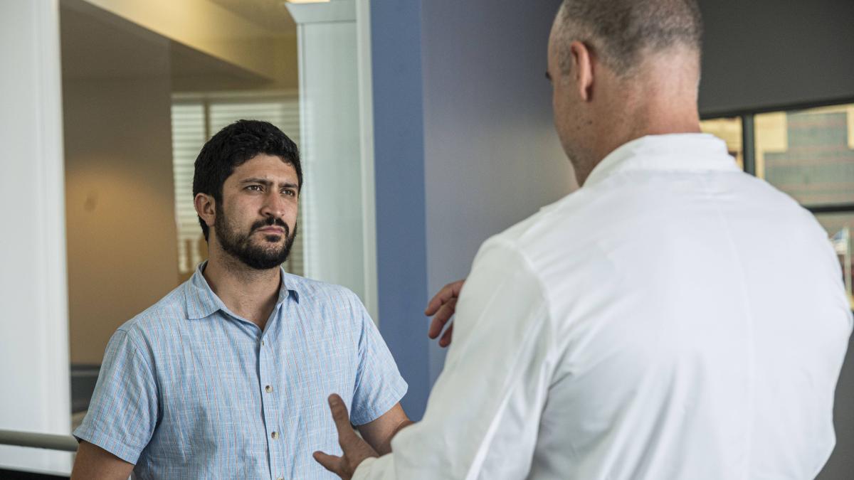 Congressman Greg Casar speaking to a constituent