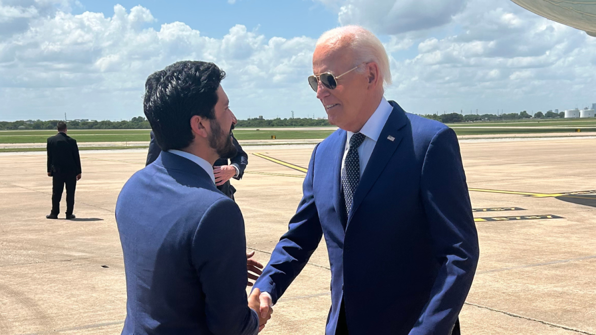 Congressman Greg Casar greets President Joe Biden on the tarmac in Austin, TX