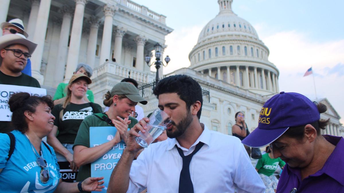 Congressman Greg Casar breaking his thirst strike, with the Capitol dome in the background