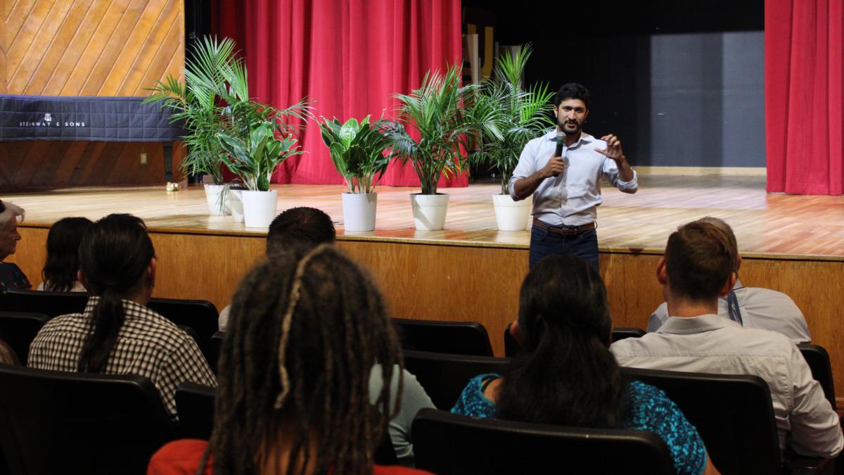 Congressman Greg Casar speaking in front of constituents at town hall