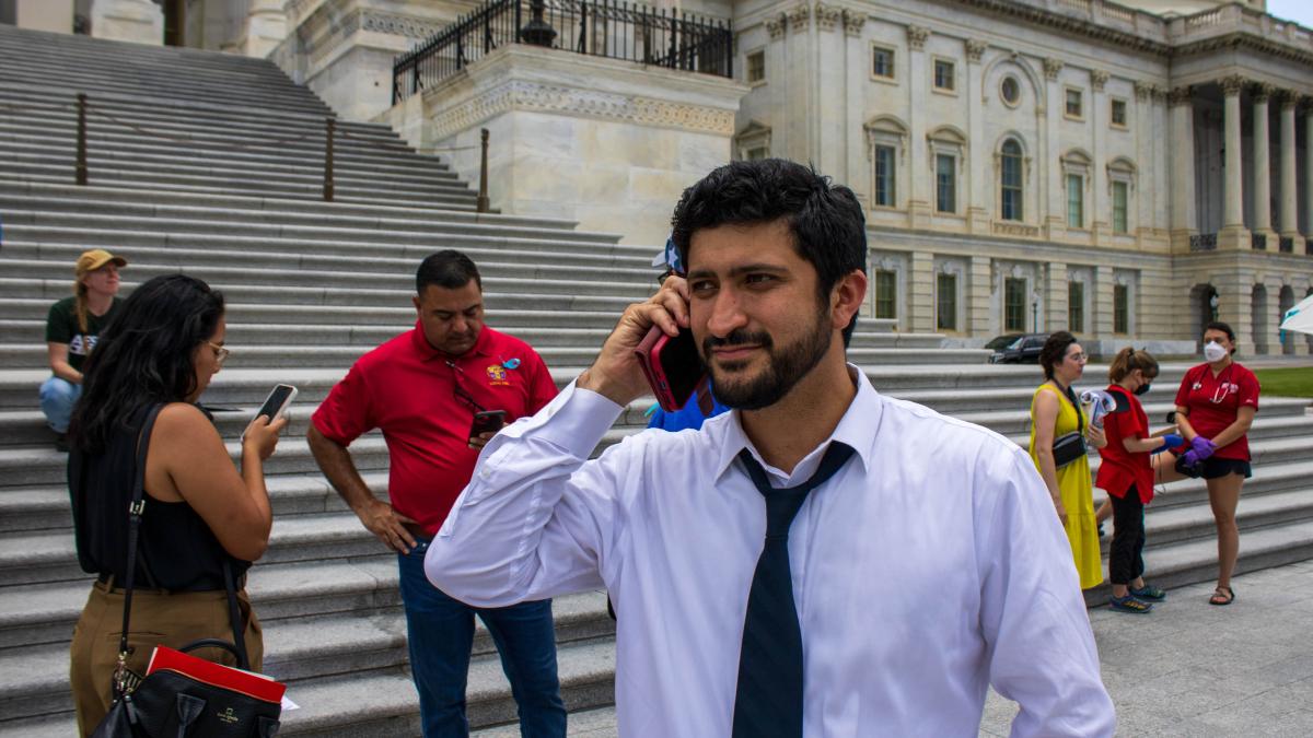 Congressman Greg Casar talking on the phone outside the House of Representatives