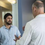 Congressman Greg Casar speaking to a constituent