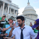 Congressman Greg Casar breaking his thirst strike, with the Capitol dome in the background