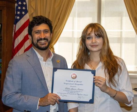 Congressman Casar posing with student artist Bella Lucia Jaimes